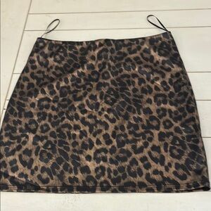 Fashion Nova mini skirt. Leopard print of goldish tan & black print.